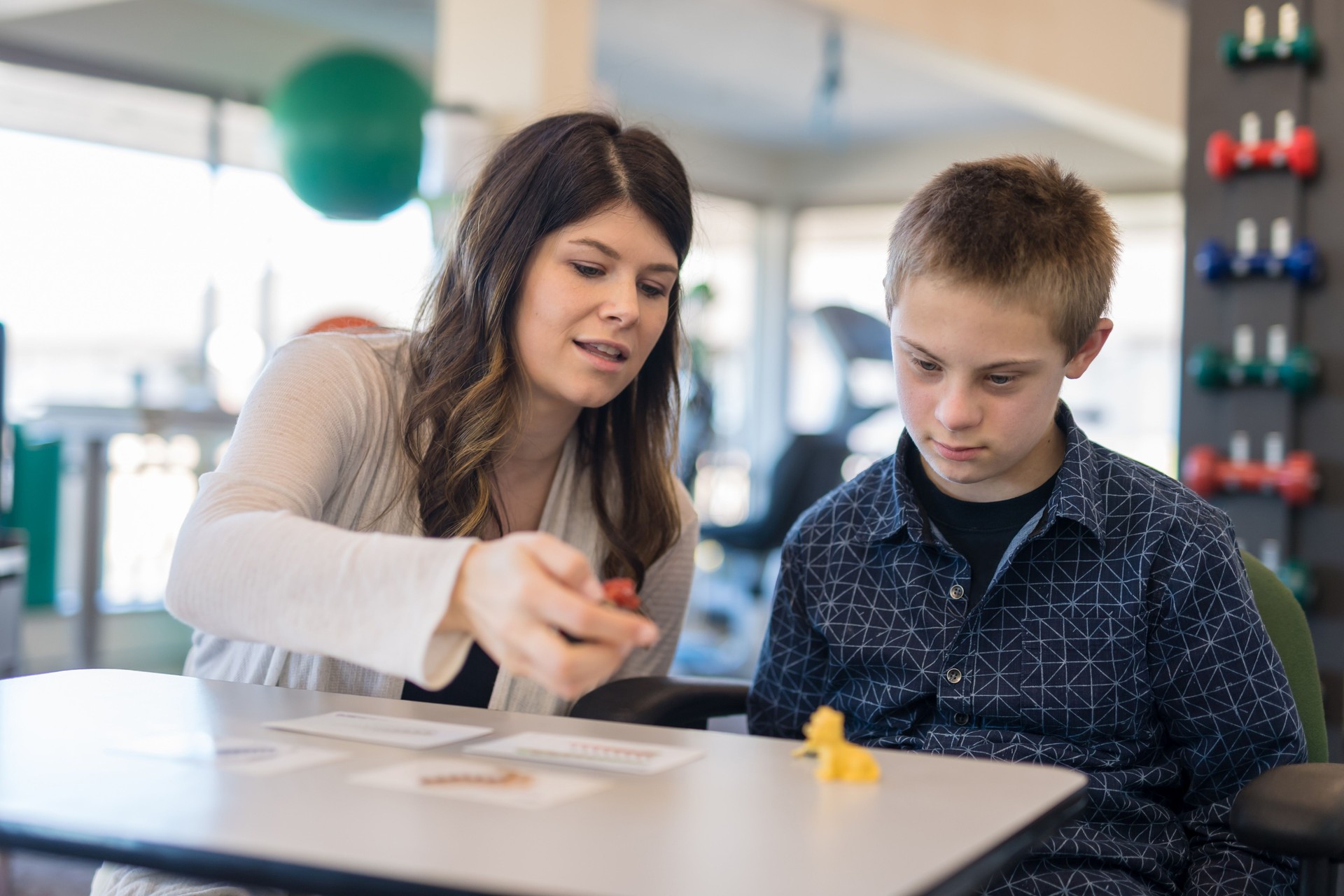 Speech therapist works with a young boy